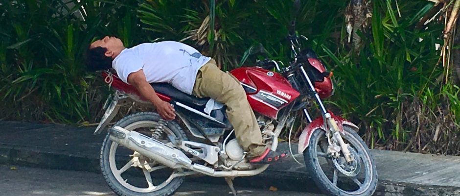 Man sleeping on motercycle