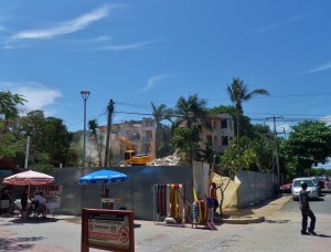 Four story building being torn down at 5th Ave and 38th St.