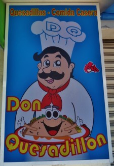 Cartoon advertisements in Playa Del Carmen