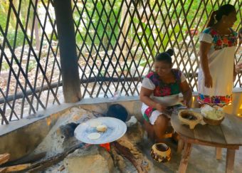Mayans making tortillas